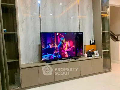 Modern living room with sleek TV unit and stylish decor
