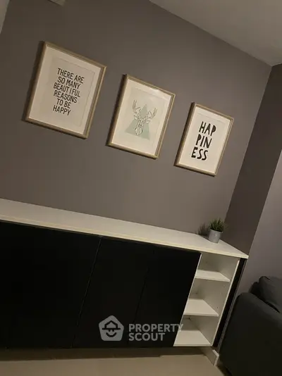 Stylish modern living room with framed art and sleek storage unit