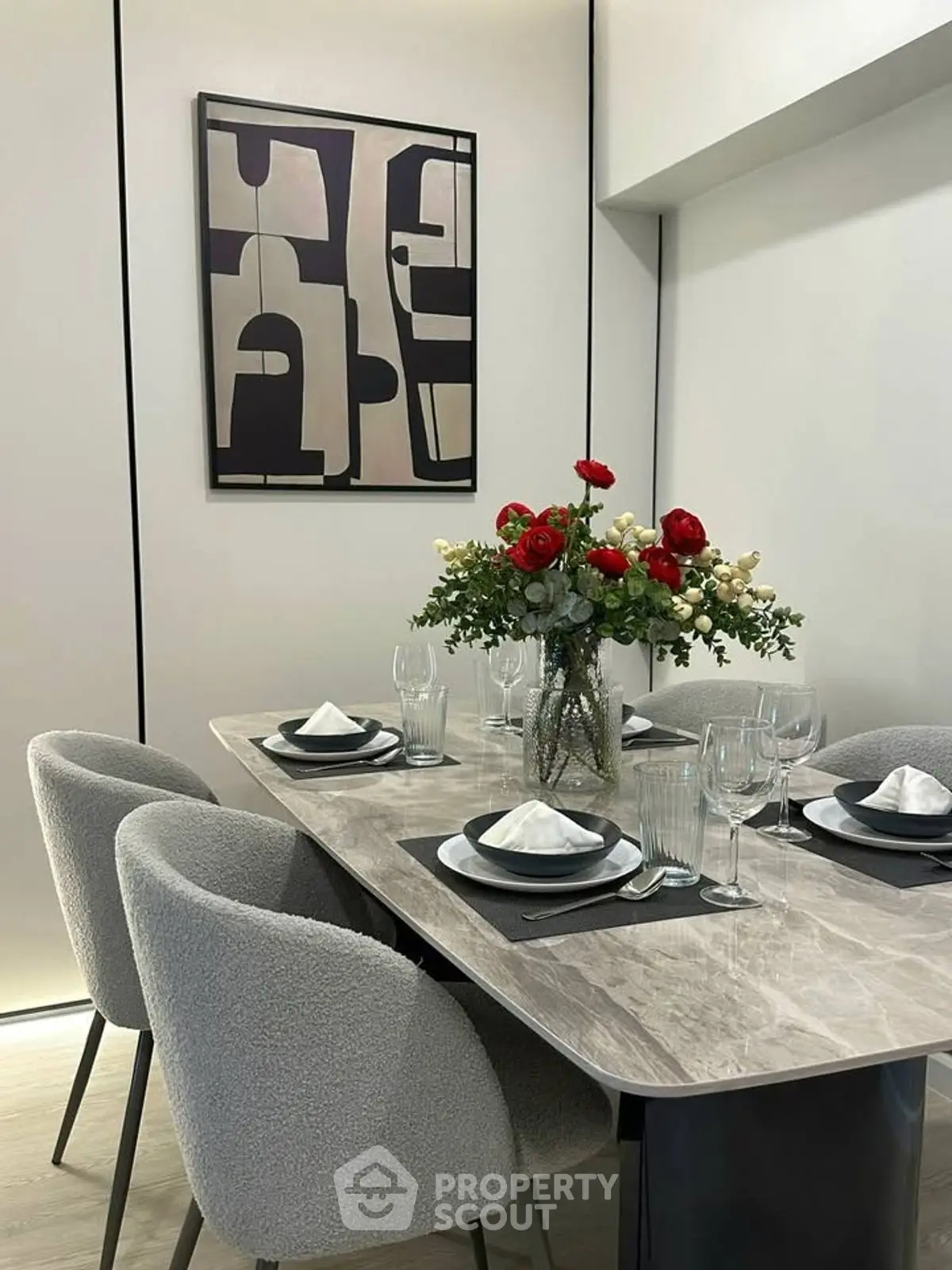 Elegant dining room with modern art and stylish table setting