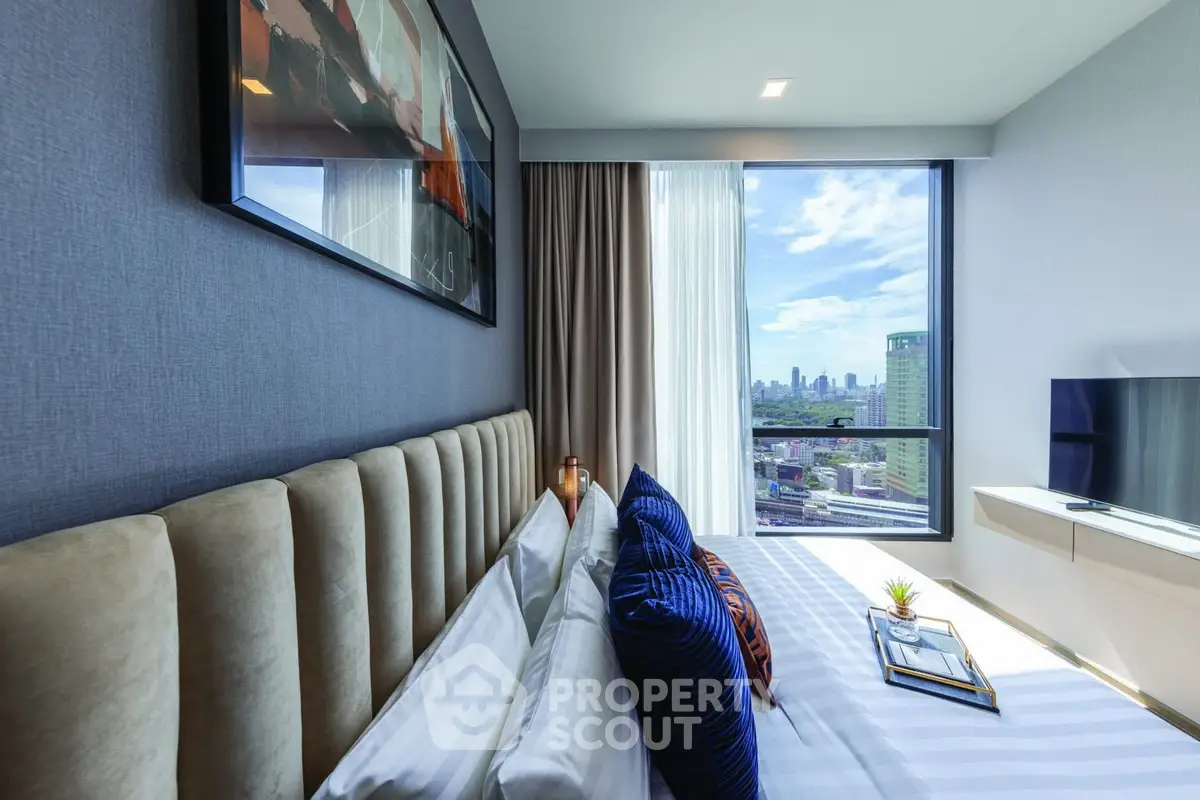 Luxurious bedroom with stunning city view and modern decor