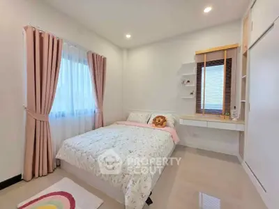 Cozy bedroom with soft lighting and elegant decor, featuring a comfortable bed and stylish curtains.