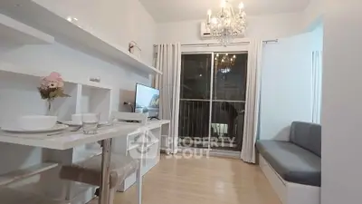 Modern living room with elegant chandelier and cozy seating area