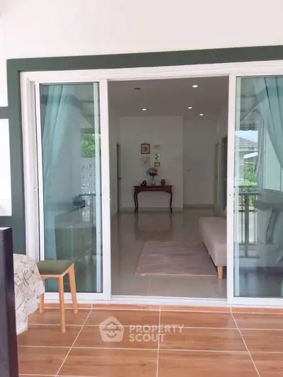 Spacious living room with sliding glass doors and elegant decor