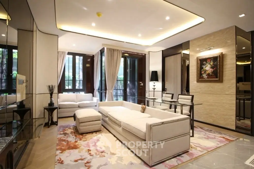 Luxurious modern living room with elegant furniture and large windows
