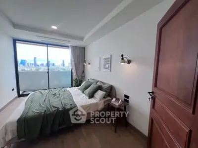 Modern bedroom with city view and stylish decor