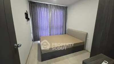 Modern minimalist bedroom with sleek design and natural light