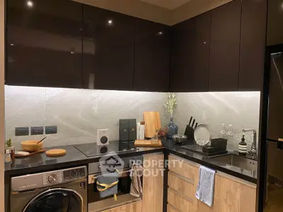 Modern kitchen with sleek cabinets, built-in appliances, and stylish decor