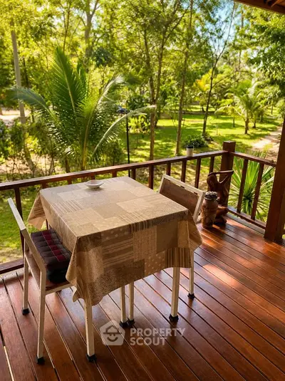 Charming wooden balcony with lush garden view, perfect for relaxing outdoors.