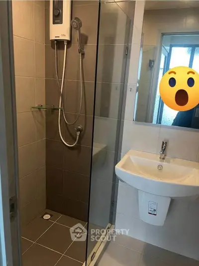 Modern bathroom with glass shower and sleek sink design