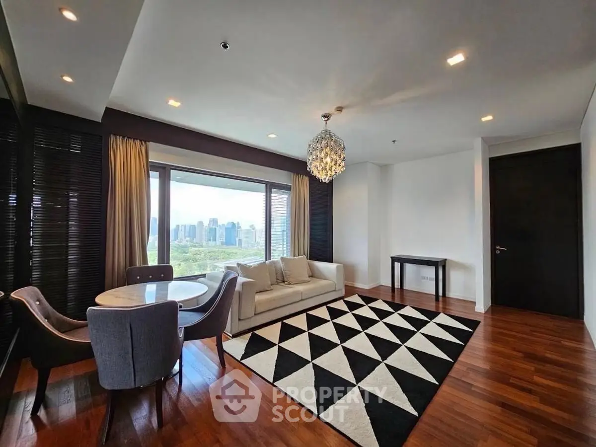 Luxurious living room with stunning city view, elegant chandelier, and modern decor in high-rise apartment.