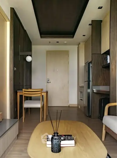 Modern living room with stylish furniture and open kitchen layout