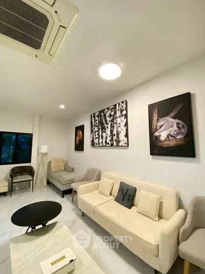 Modern living room with stylish decor and comfortable seating, perfect for relaxation and entertaining.