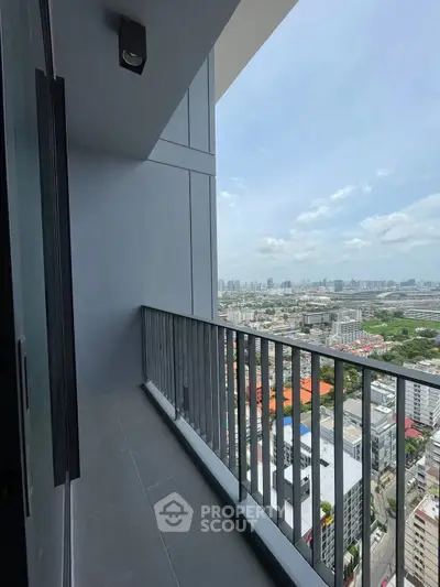 Stunning high-rise balcony with panoramic city views, perfect for urban living.