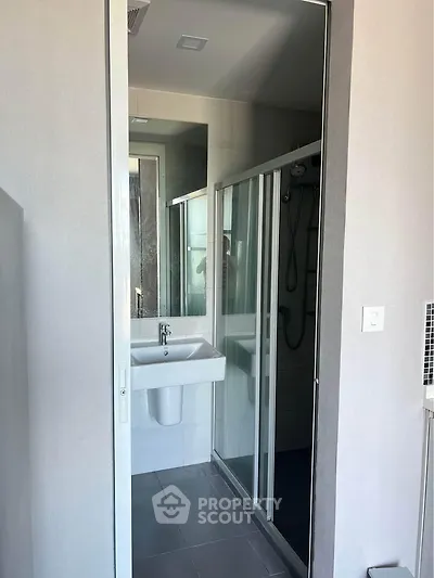 Modern bathroom with sleek shower and minimalist sink design
