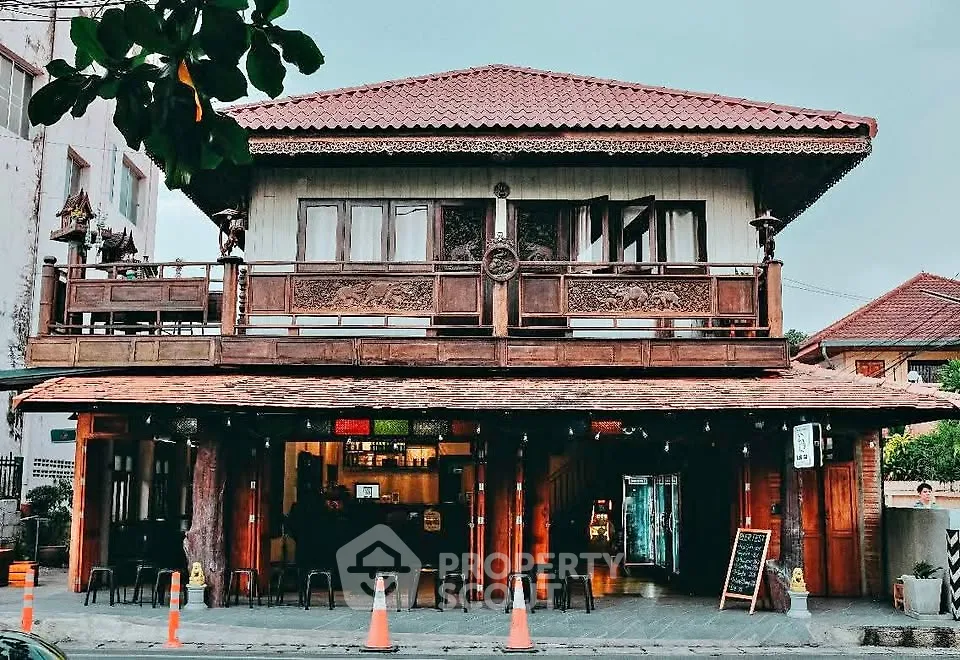 Charming traditional wooden house with intricate balcony design and rustic appeal.
