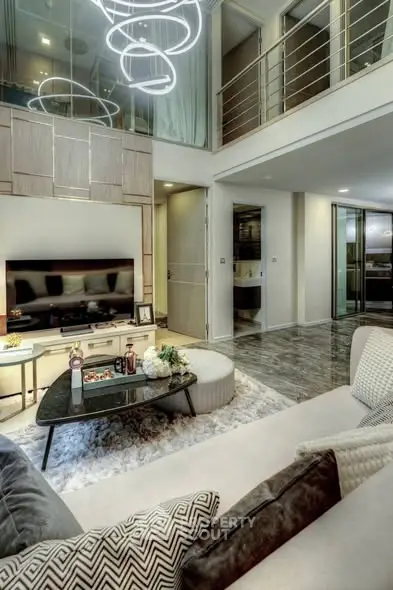 Luxurious modern living room with high ceilings and elegant lighting