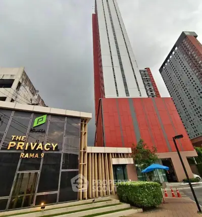 Modern high-rise building with sleek design at The Privacy Rama 9, showcasing urban living in Bangkok.