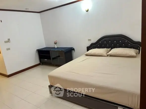 Spacious bedroom with elegant bed and minimalist decor