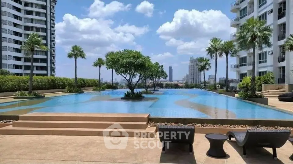 Luxurious rooftop pool with stunning city views and modern seating area.