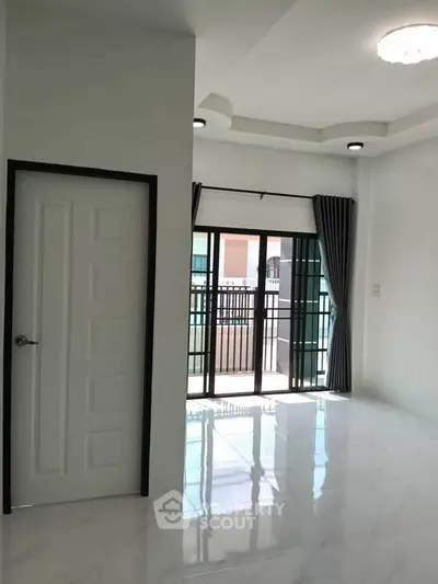 Bright and spacious interior with large windows and modern design.