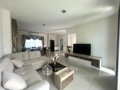 Spacious modern living room with elegant decor and natural light
