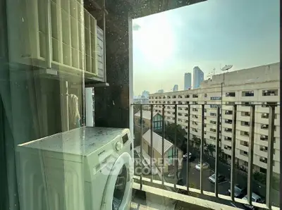 City view from balcony with washing machine and urban skyline