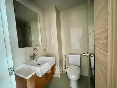 Modern bathroom with sleek fixtures and minimalist design in a contemporary home.