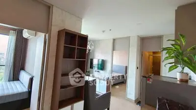 Modern apartment interior with open layout, featuring stylish furniture and natural light.