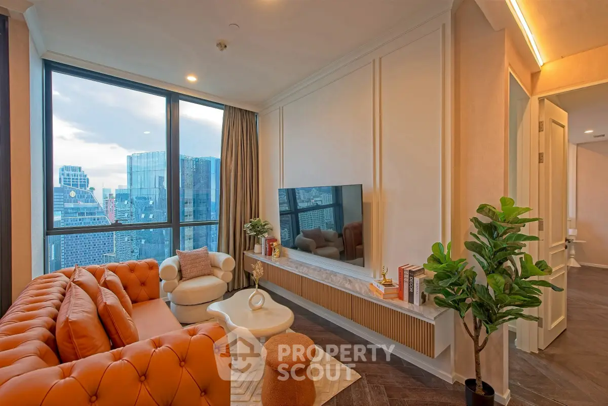 Luxurious living room with stunning city view, modern furniture, and elegant decor in high-rise apartment.