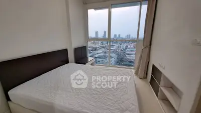 Modern bedroom with panoramic city view and large windows