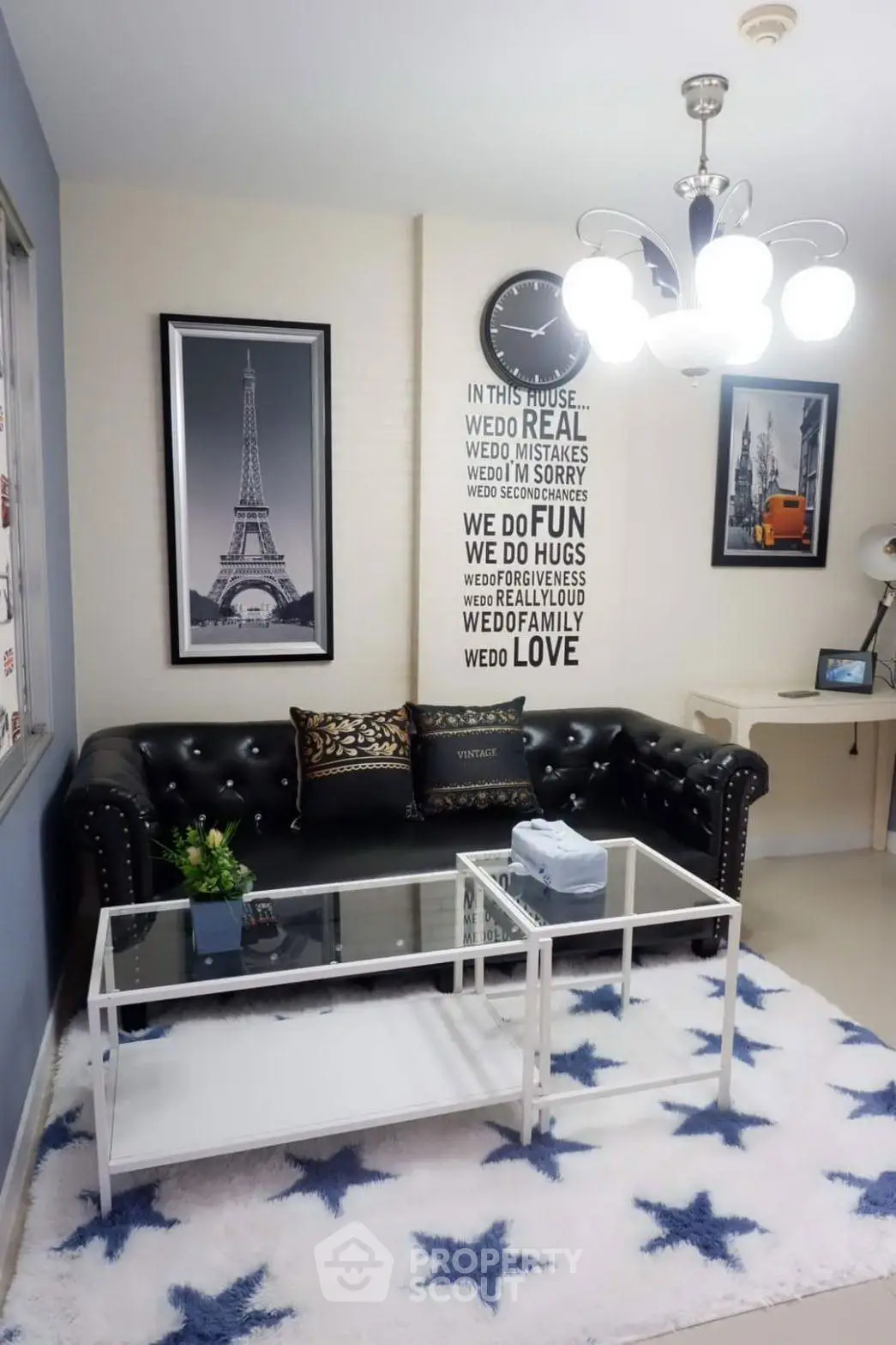 Stylish living room with modern decor and chic black leather sofa