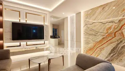 Luxurious modern living room with elegant marble accent wall and sleek furniture