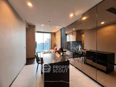 Luxurious modern living room with open kitchen and stunning city view, featuring sleek design and elegant furnishings.