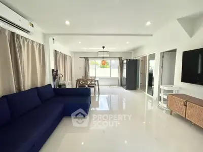 Spacious modern living room with sleek furniture and natural light