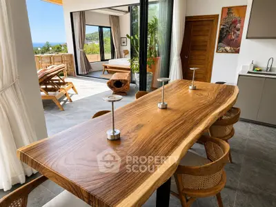Luxurious open-plan living room with stunning wooden table and expansive views