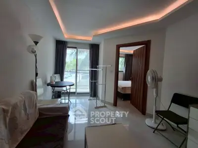 Cozy living room with modern lighting and large window view