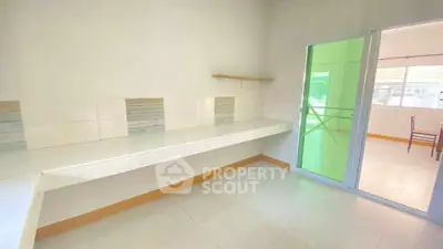 Spacious kitchen with modern open layout and sliding glass doors