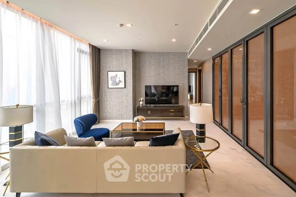 Luxurious modern living room with elegant furniture and large windows