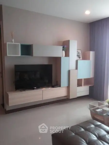 Modern living room with stylish TV unit and elegant decor