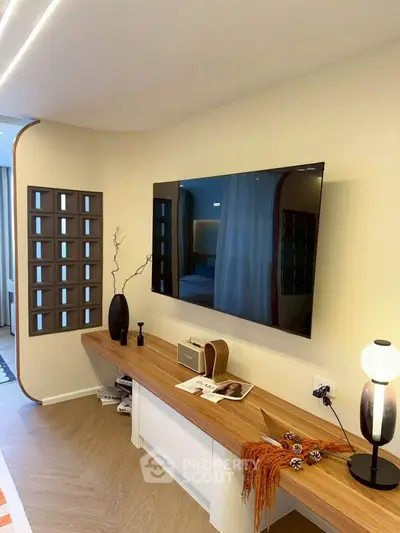 Modern living room with wall-mounted TV and stylish decor