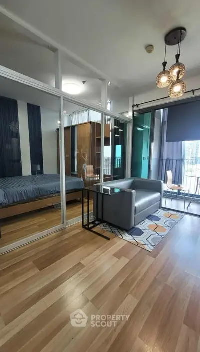 Modern apartment with glass-walled bedroom and stylish living area