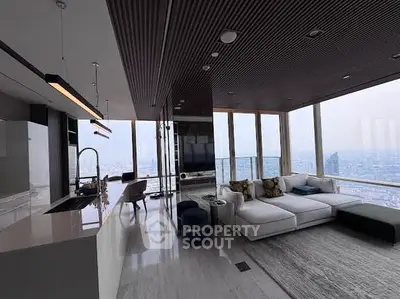 Luxurious high-rise living room with panoramic city views and modern furnishings