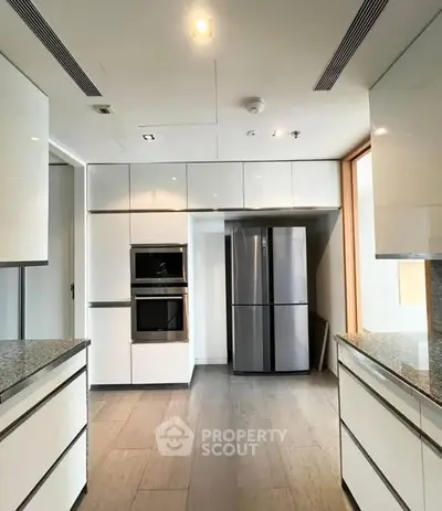 Modern kitchen with sleek cabinetry and stainless steel appliances