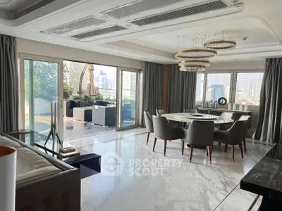 Luxurious living room with marble floors, elegant dining area, and spacious balcony with city views.