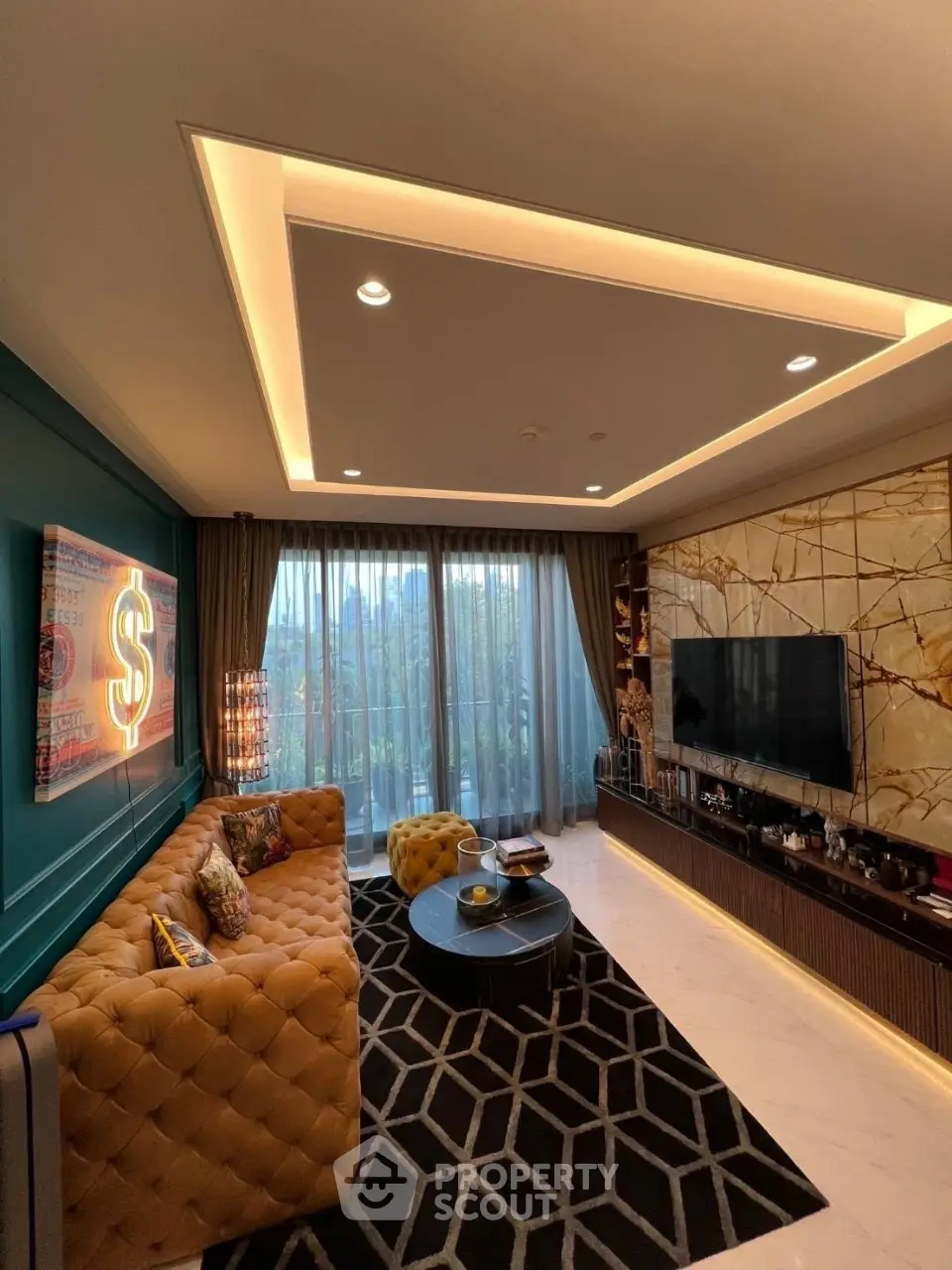 Luxurious living room with modern decor, plush sofa, and large windows offering natural light.