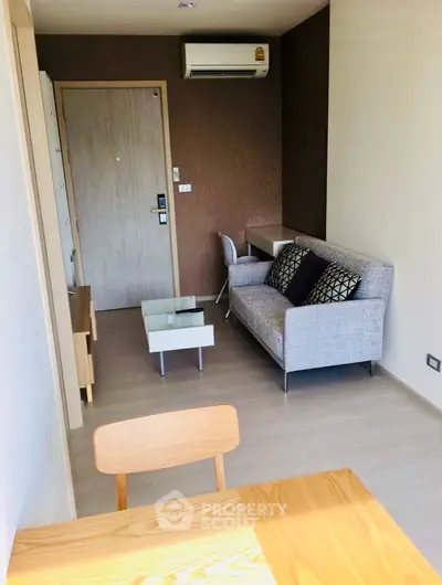 Modern living room with stylish furniture and air conditioning in a cozy apartment.