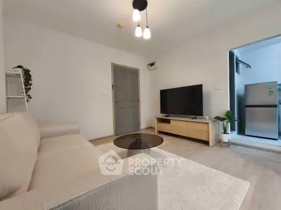 Modern living room with cozy sofa, sleek TV setup, and stylish decor