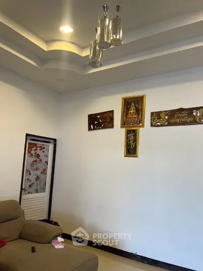 Cozy living room with modern ceiling lights and decorative wall art