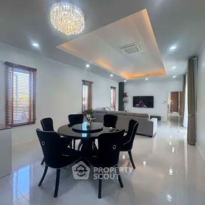 Luxurious modern living room with elegant dining area and stylish lighting
