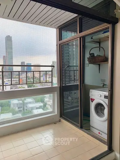 High-rise balcony with laundry area and cityscape view, perfect for urban living.